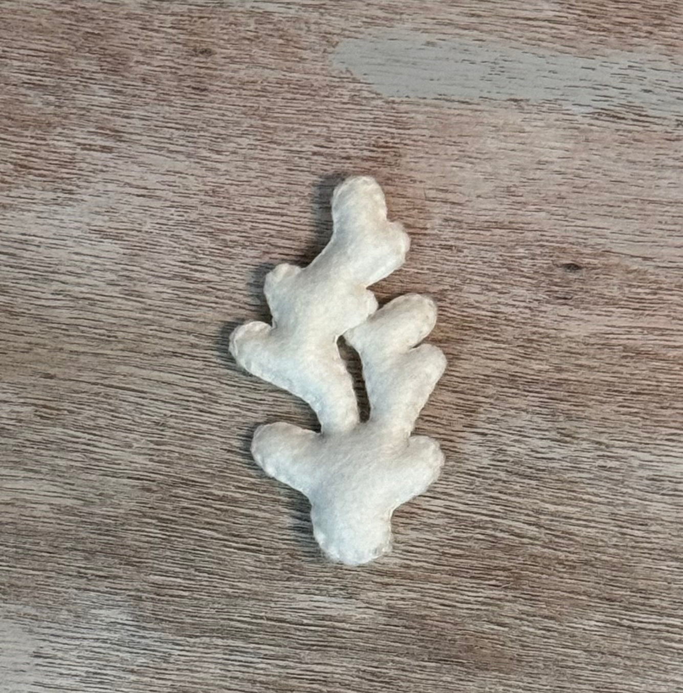 handmade and hand sewn felt creation by a little bit whimsy - brightly colors . primary colors and pastel white coral