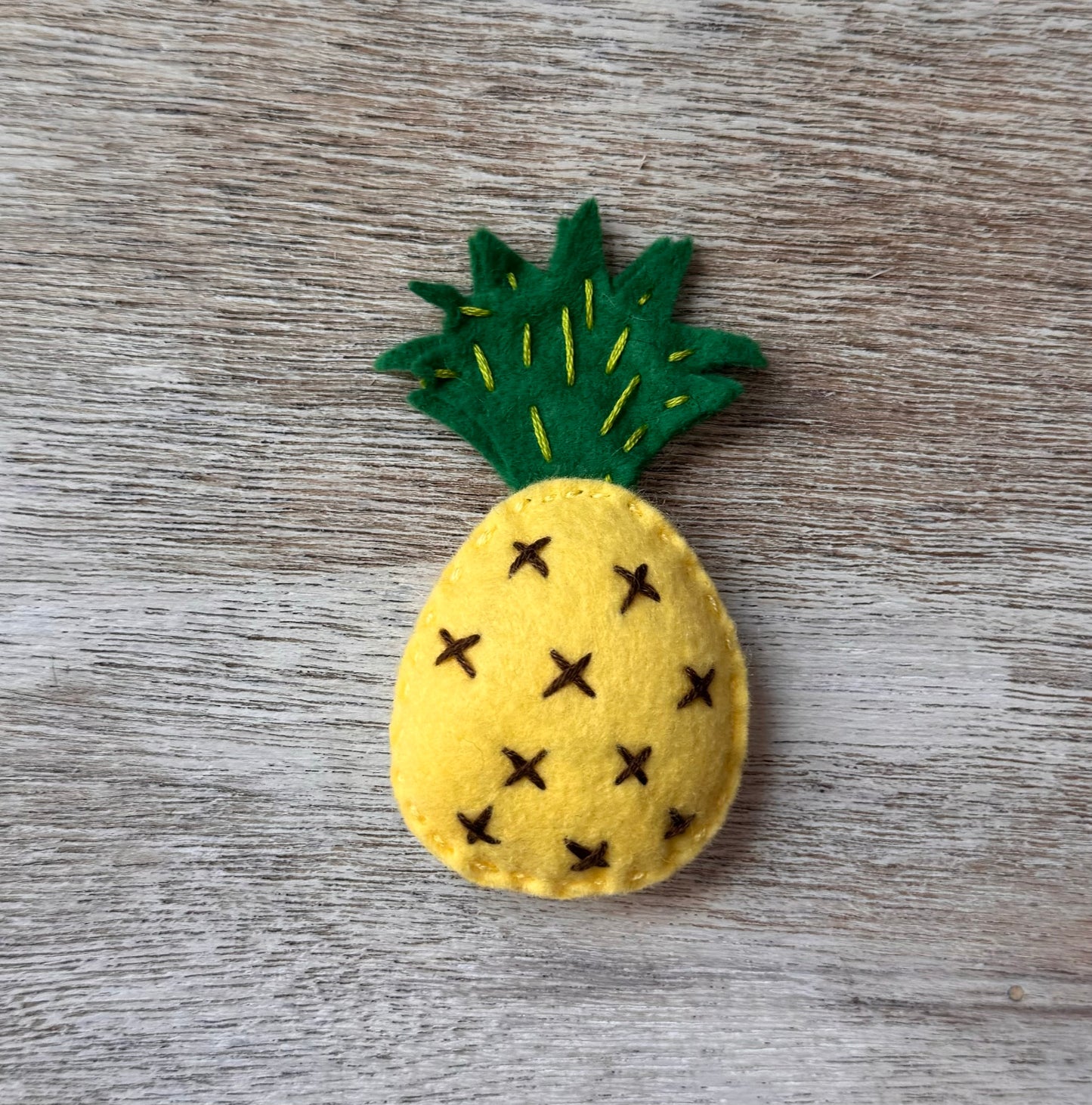 handmade and hand sewn felt creation by a little bit whimsy - brightly colors . primary colors and pastel yellow and green pineapple