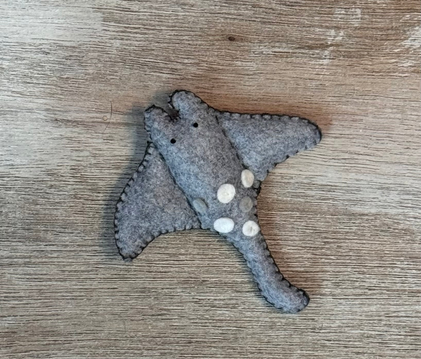 handmade and hand sewn felt creation by a little bit whimsy -sea animals/ creatures. primary colors and pastels  smiling gray sea ray