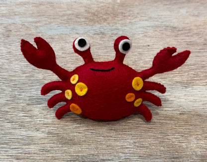 handmade and hand sewn felt creation by a little bit whimsy - brightly colors sea animals/ creatures. primary colors and pastels  smilng red and orange crab